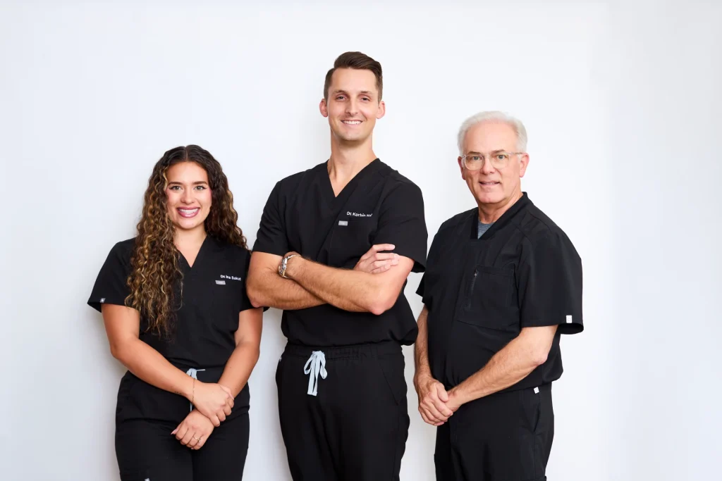 Dr. Korbin Hally, Dr. Tim Rudd, and Dr. Ina Sukut at Coffee Creek Family Dentistry in Edmond, OK