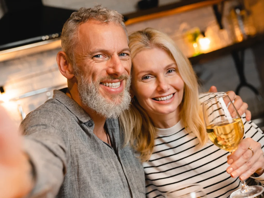 Couple smiling together with perfect teeth | Cosmetic dentistry in Edmond, OK